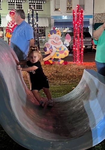 Child Playing on Sculpture