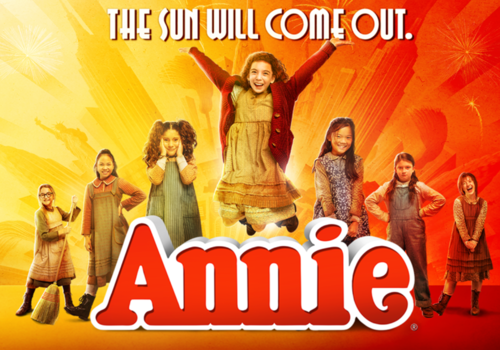 Annie promo image (red, orange, and yellow background with characters)