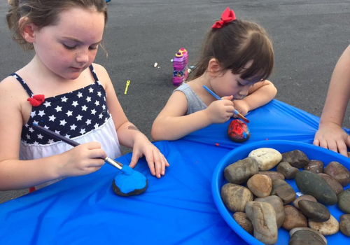 Girls painting rocks