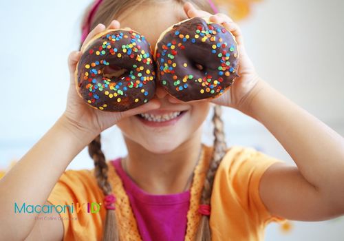Girl with donuts over eyes