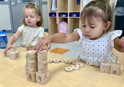 girls playing with blocks