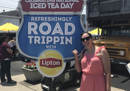 Gretchen with the Refreshingly Road Trippin' with Lipton sign