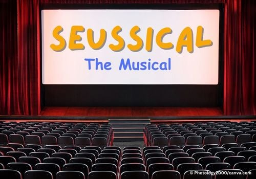 Empty auditorium with Seussical The Musical written on a screen on a stage