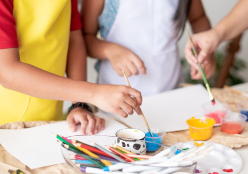 Children painting, close up of hands, Project Indigo Studio