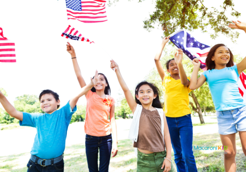 Diverse American kids wave American flags