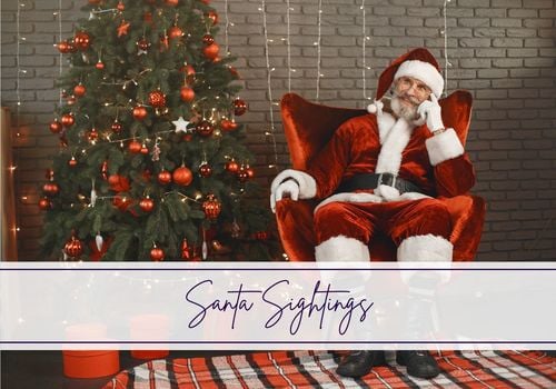 Santa sitting in chair by Christmas Tree with 