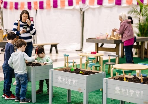 children playing at the flower show