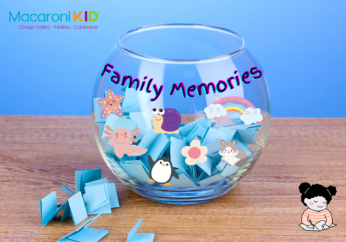 Family Memory jar - decorated clear glass bowl filled with small slips of blue paper