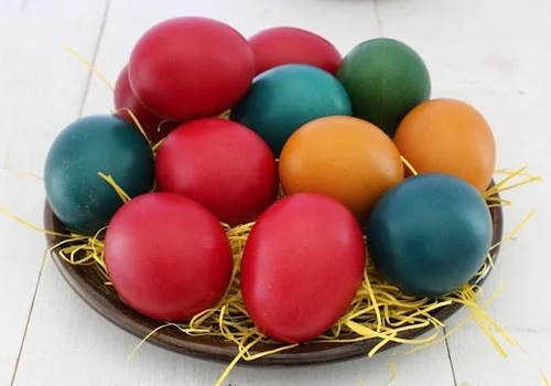 Bowl full of different colored easter eggs