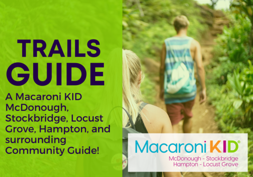 two people hiking and words Trails Guide