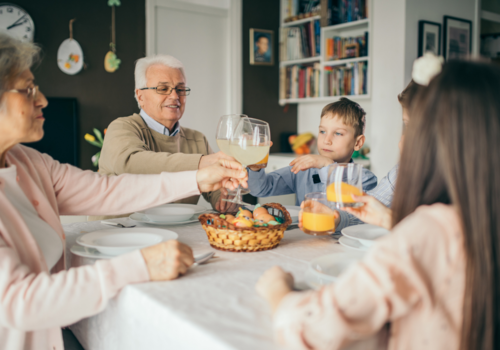 grandparents with kids eating easter meal