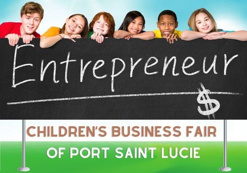 Children entrepreneurs behind black Entrepreneur sign