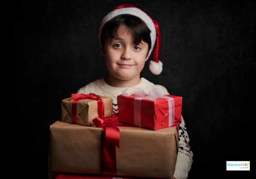 boy with christmas gifts