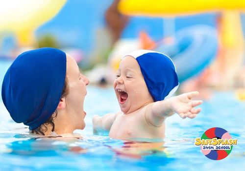 Mother and baby in pool