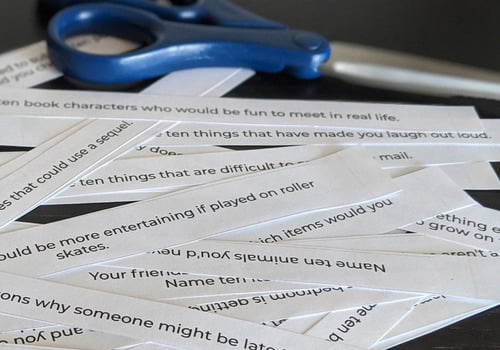 31 Prompts for Creative Conversations with Kids cut into strips with scissors nearby