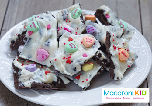 Valentine candy bark with tiny hearts and sprinkles and colorful conversation hearts