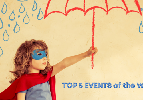 child with shoulder-lenghth wavy, dirty-blonde hair wearing red cape and blue eye mask holding red cartoon umbrella on a background of blue raindrops, text reads Top 5 Events of the Week