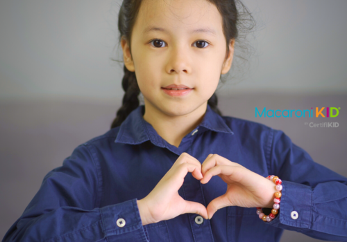 Little Girl with a Heart Shape Hand Gesture