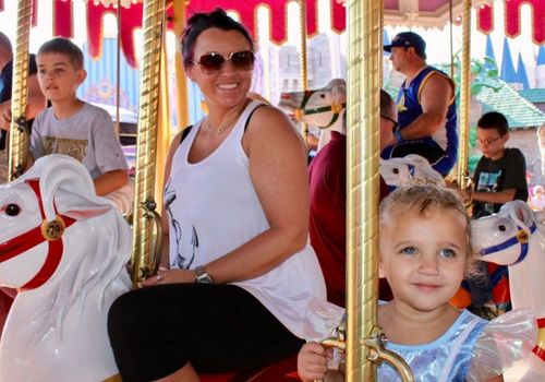Family riding the carousel at Magic Kingdom Florida