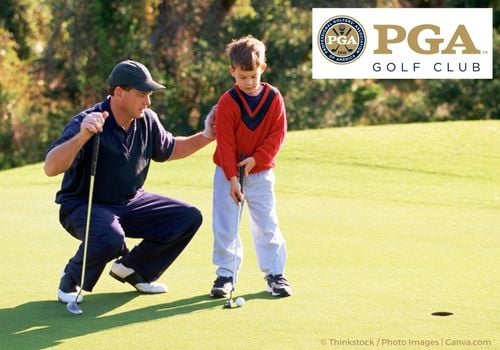 father and young son playing golf