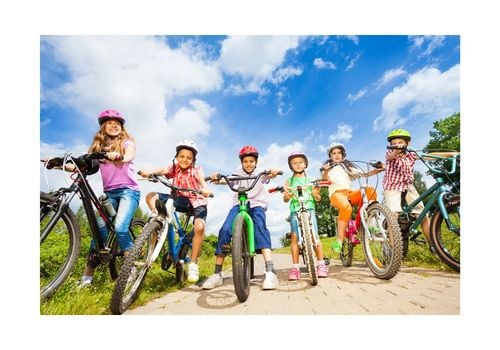 6 kids on bikes with helmets