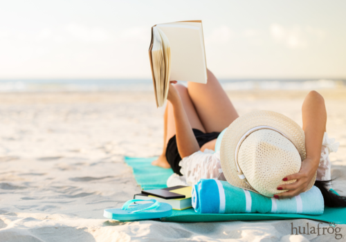 woman reading on the beach