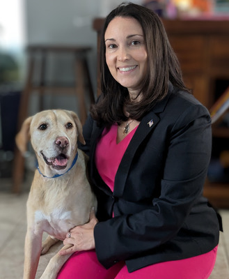 Publisher sitting with her labrador retriever.