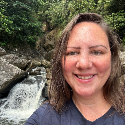 head in front of waterfall