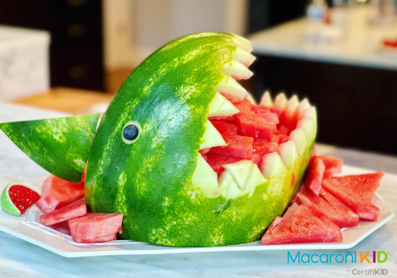 a watermelon carved into a shark figure