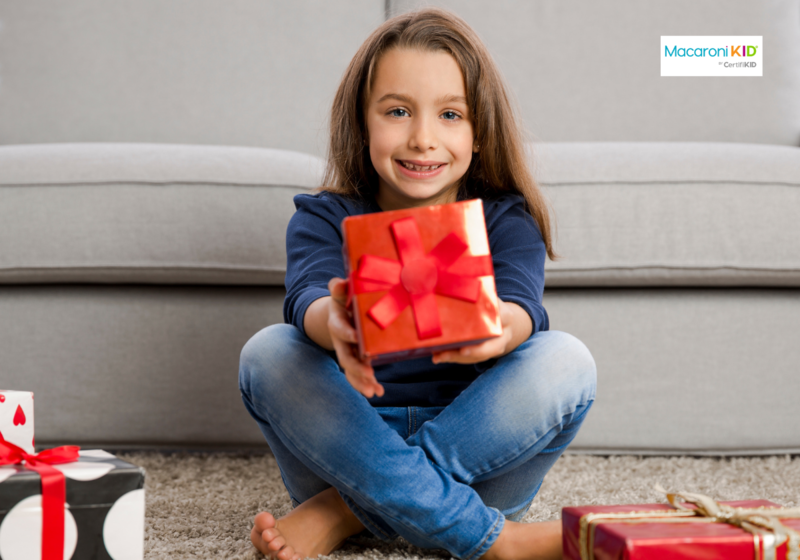 little girl opening presents