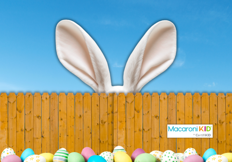 Easter Guide to Local Fun. Easter bunny ears peeking over fence with eggs in front.