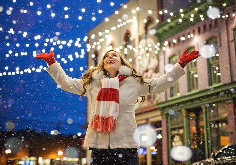 woman looking at holiday lights