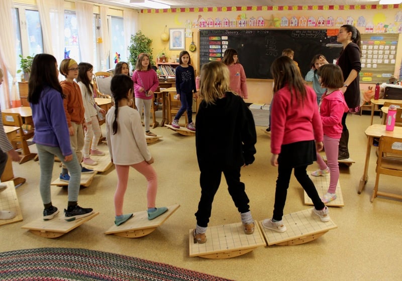 students on balance boards