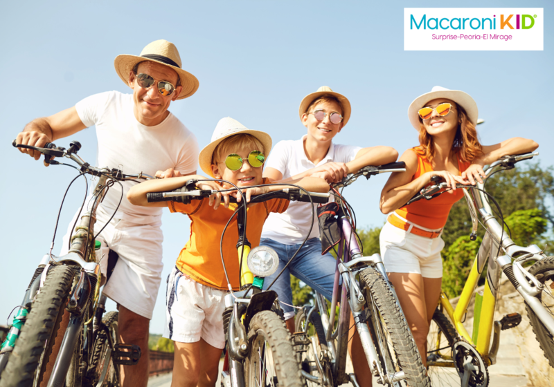 Happy family on bicycles in the summer