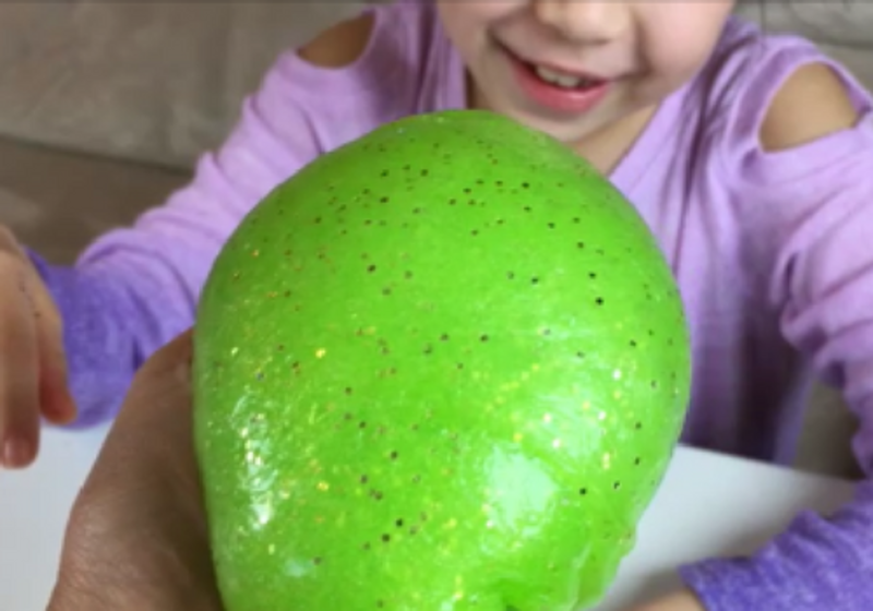 photo of DIY green slime with gold glitter