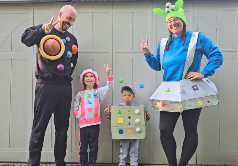 Family dressed for Halloween in space costumes made with clothes bought at Clothing Shop Online