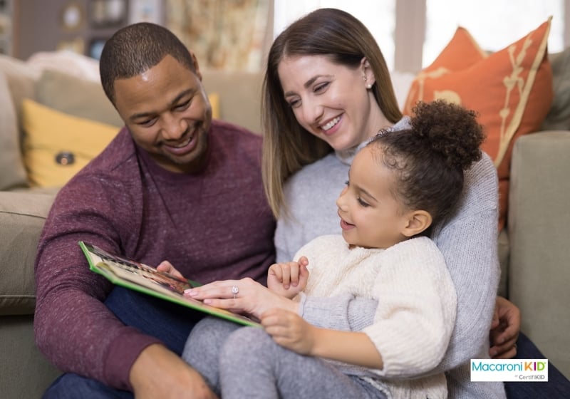 Family reading a book together