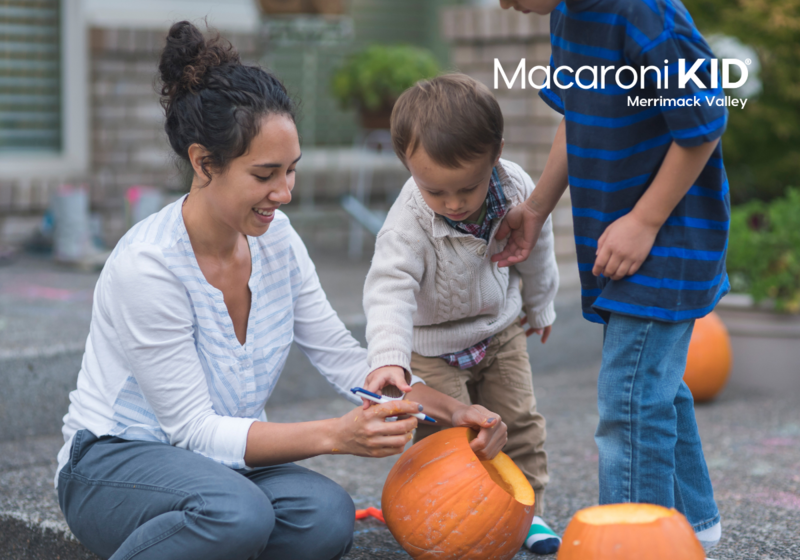 Family decorating pumpkins