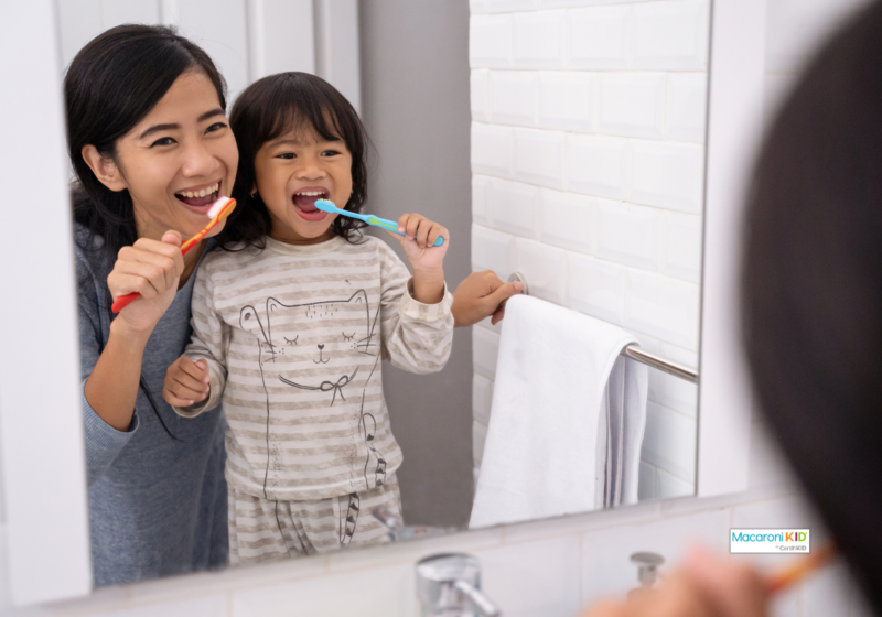 mom and kid brushing teeth
