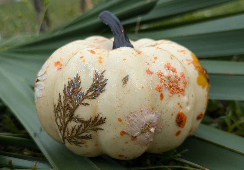 White pumpkin with dried flowers and sparkles