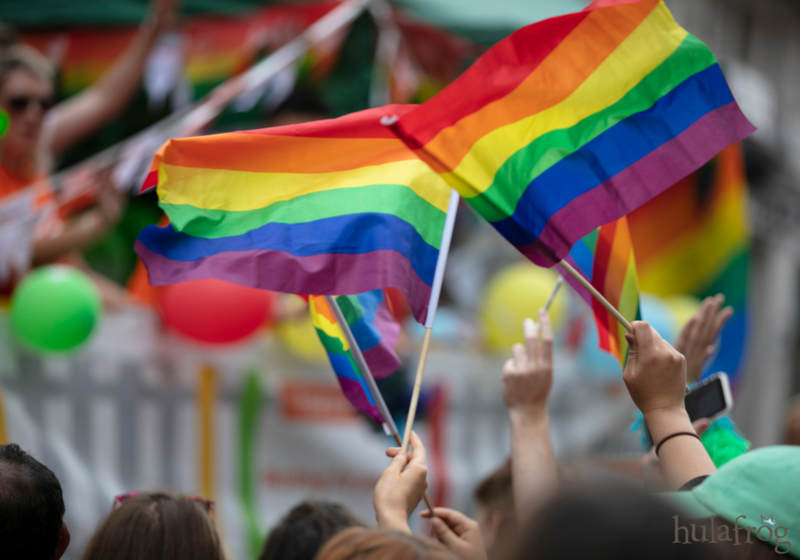 crowd waving pride flags