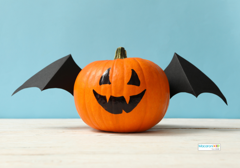 a painted pumpkin with thumbtacked wings makes a cute bat. easy pumpkin decorating hacks.