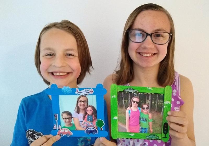 Kids holding frames for dad
