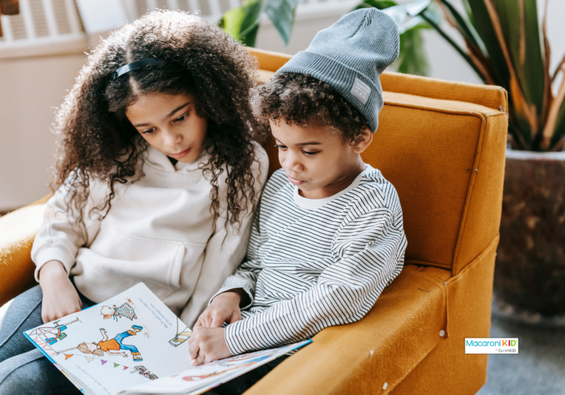 kids reading together on a chair