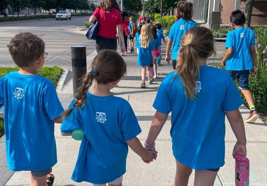 Kids holding hands and walking