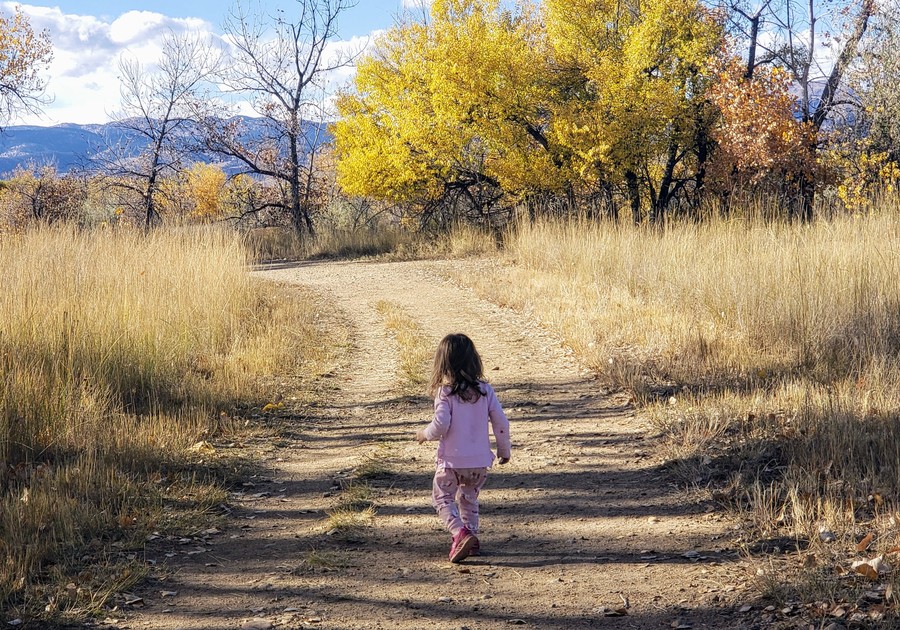 young girl hiking at Sawhill Ponds in the fall