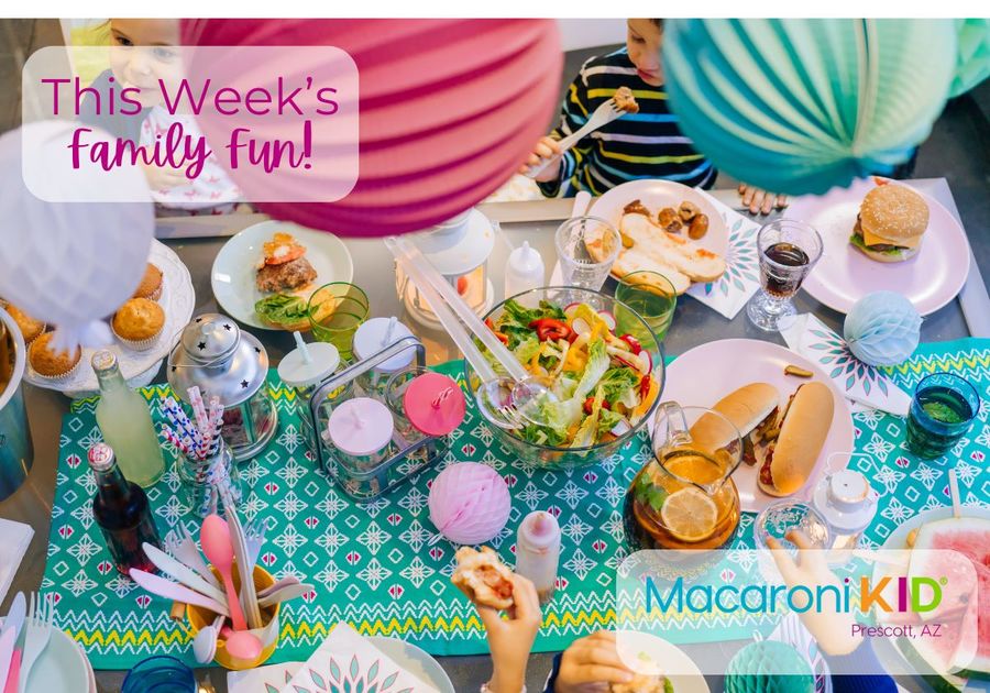 A brightly decorated table with food and kids eating.