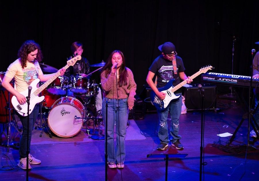 teen band performing on stage