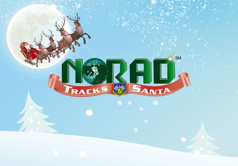 Santa and reindeer flying in the night sky with NORAD Tracks Santa logo.