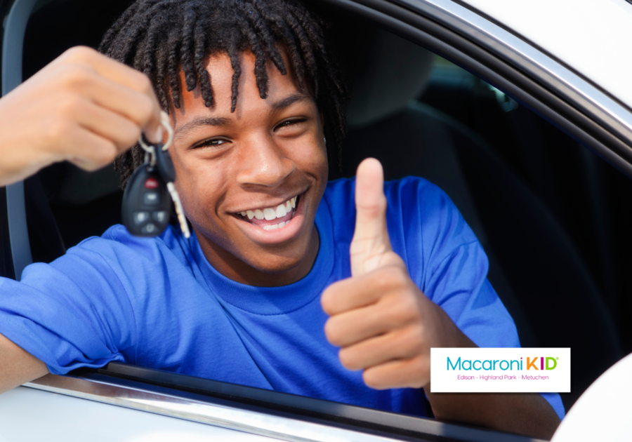 Teen giving thumbs up outside of car window